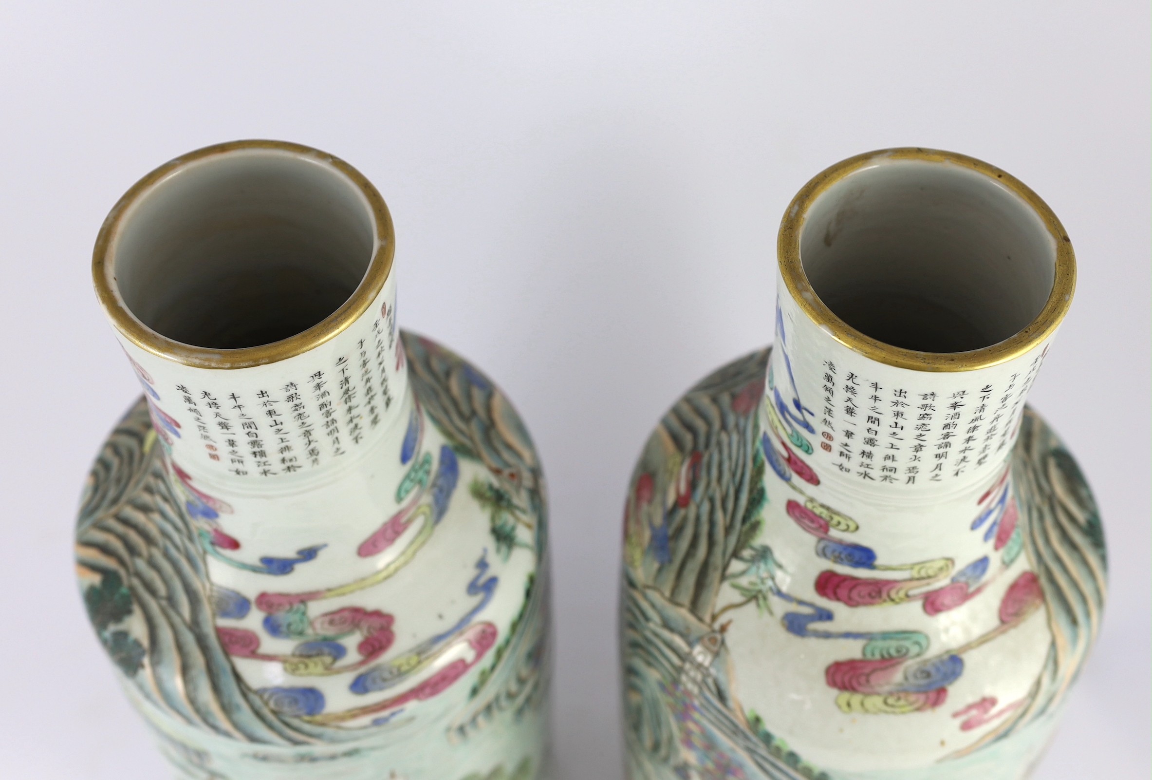 A pair of Chinese famille rose fencai inscribed vases, mid 19th century, 45cm high, cracks to neck of one vase